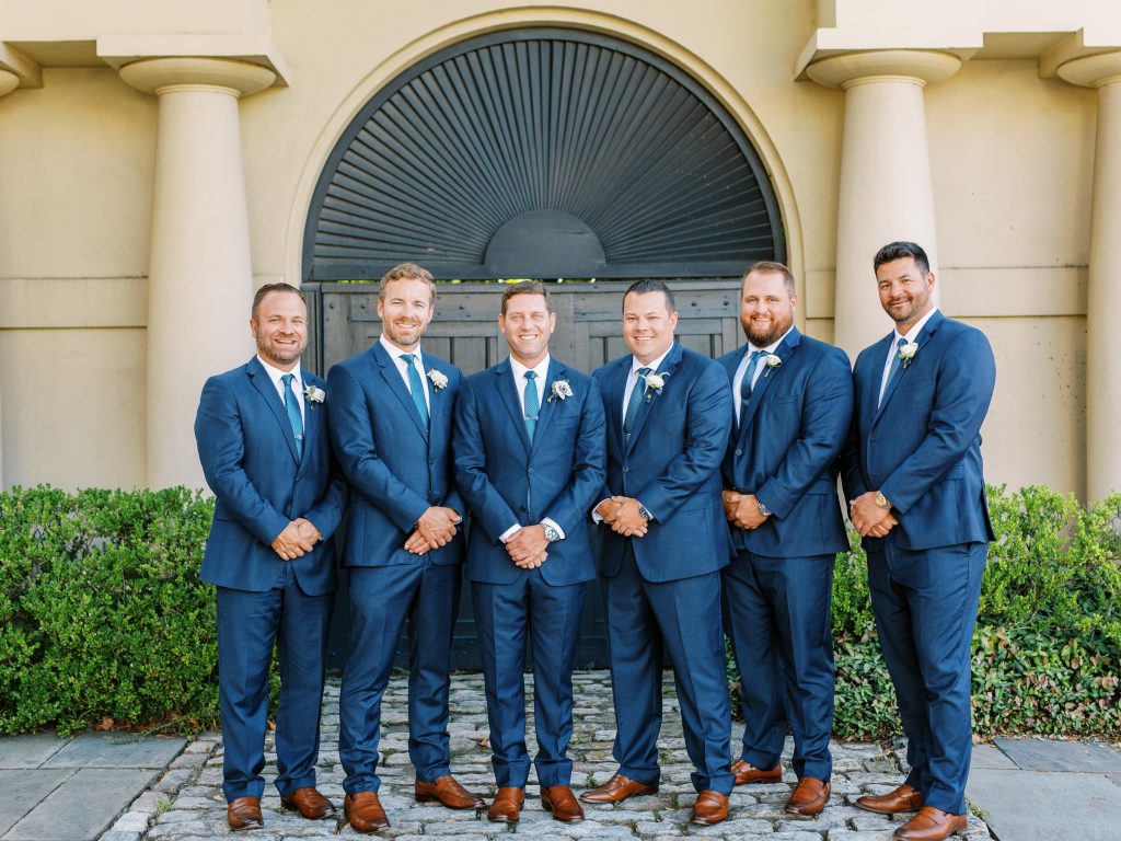 Groomsmen in navy blue suits