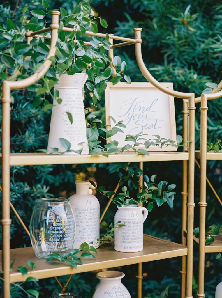Wedding seating chart with white jugs 