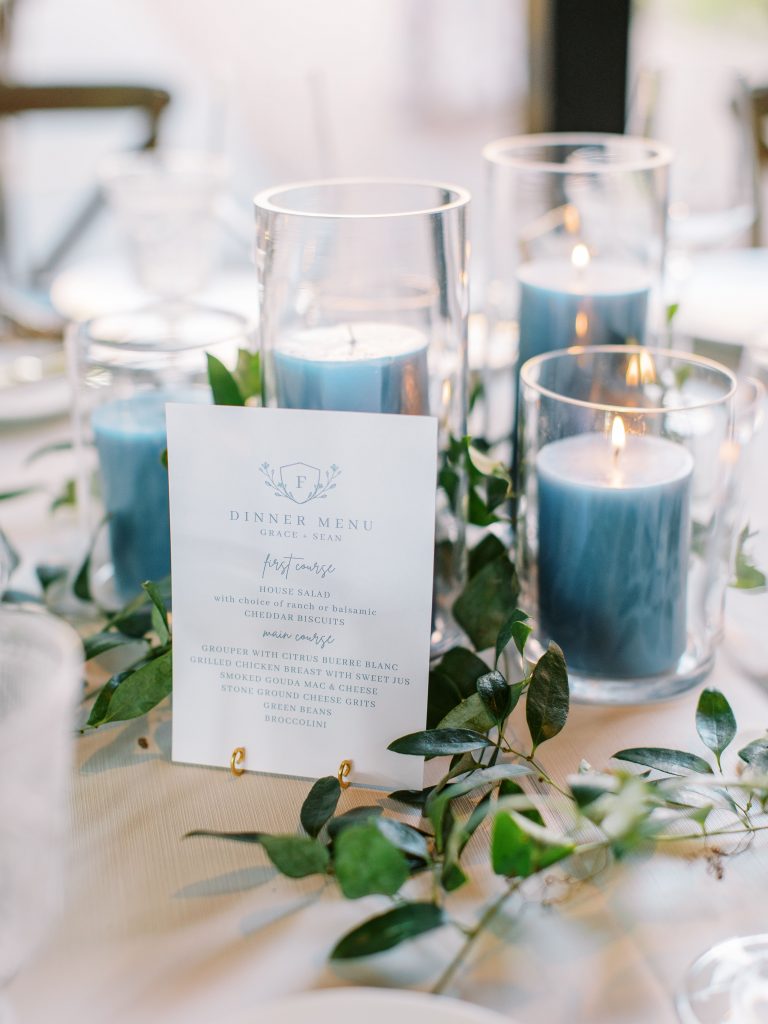 Blue candle centrepiece with greenery