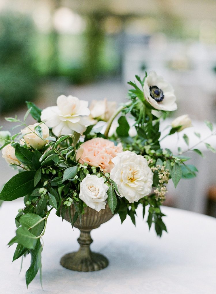 Peach and white wedding centrepiece