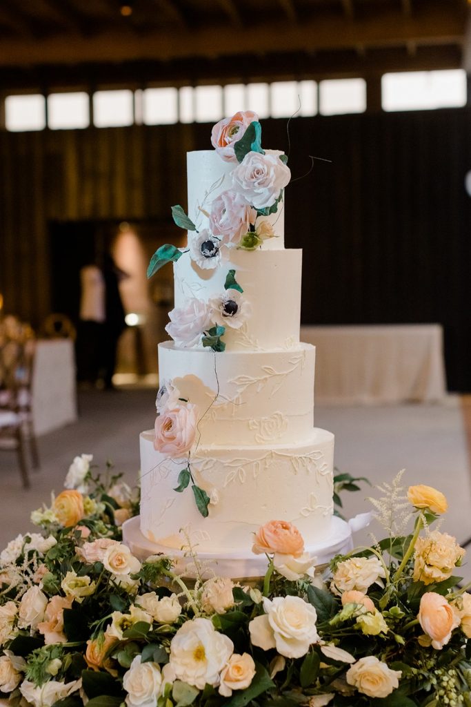 Peach and white buttercream wedding cake