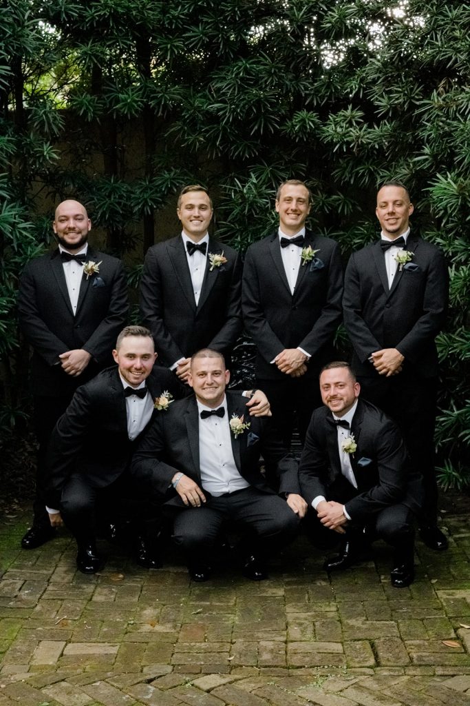 Groomsmen in black tuxedos