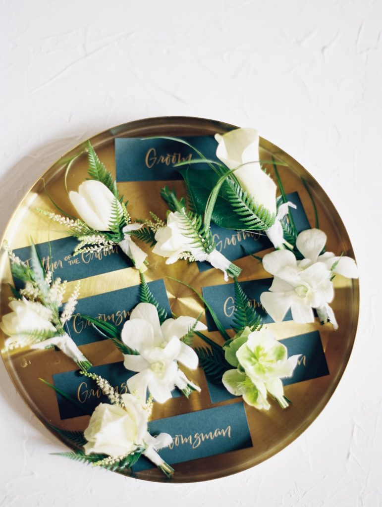 White groomsmen boutonnieres