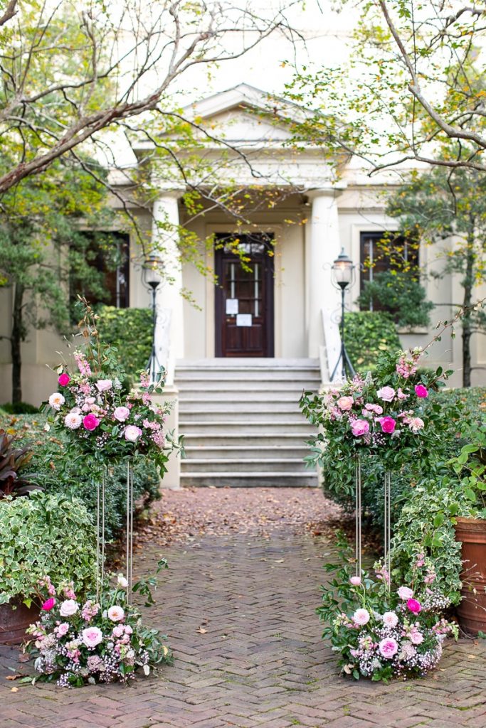 pink wedding ceremony flowers for wedding at Ships of the Sea Maritime Museum