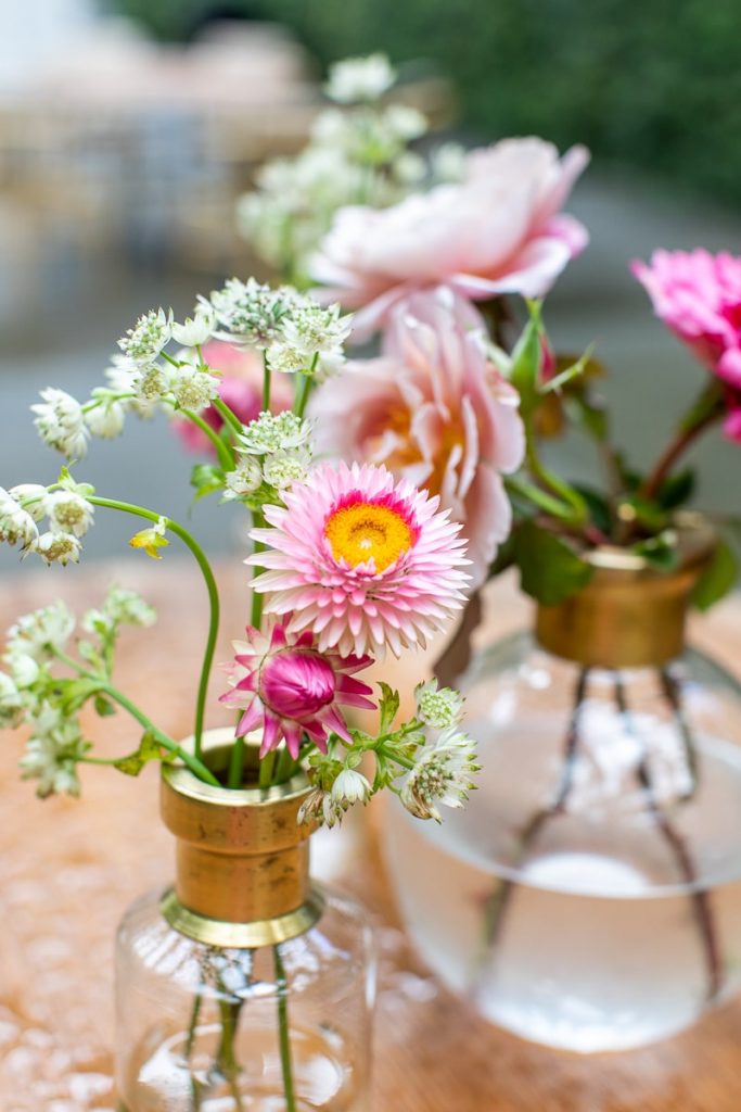 pink flowers in bud vases for wedding at Ships of the Sea Maritime Museum