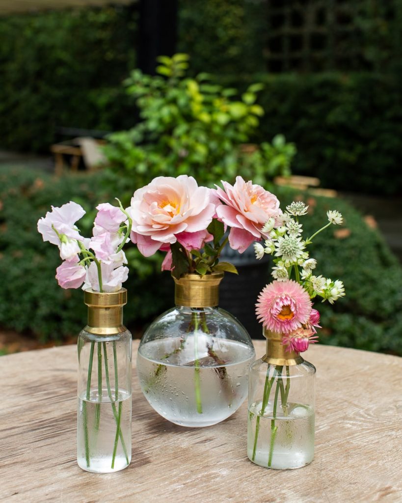 pink flowers in bud vases for wedding at Ships of the Sea Maritime Museum
