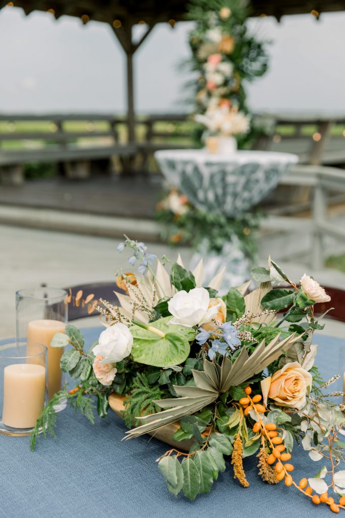 Tropical floral centrepiece with orange and blue flowers