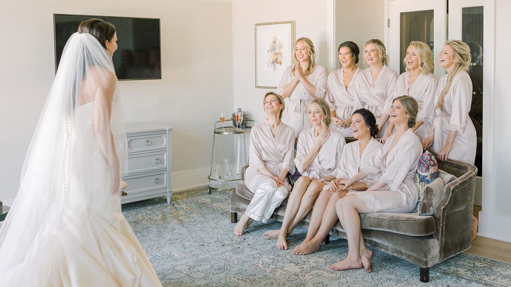 bride and bridesmaids first look