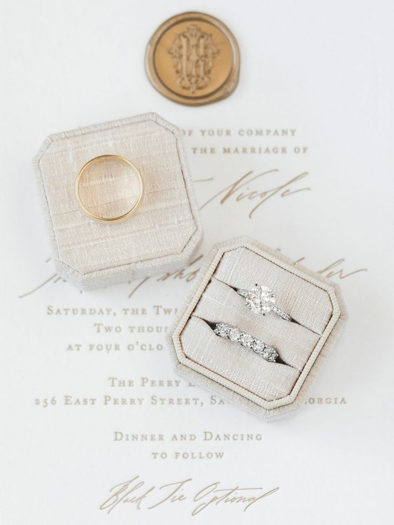 wedding rings and tan ring box