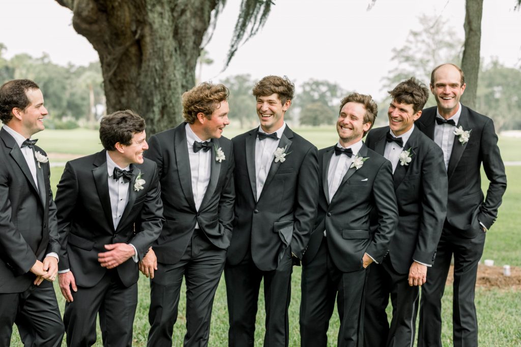 Groomsmen in black tuxedos