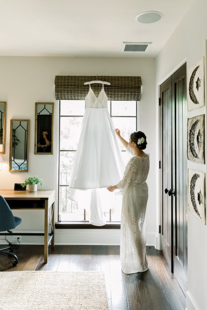 Georgia bride looking at her wedding dress at Sea Island Resort