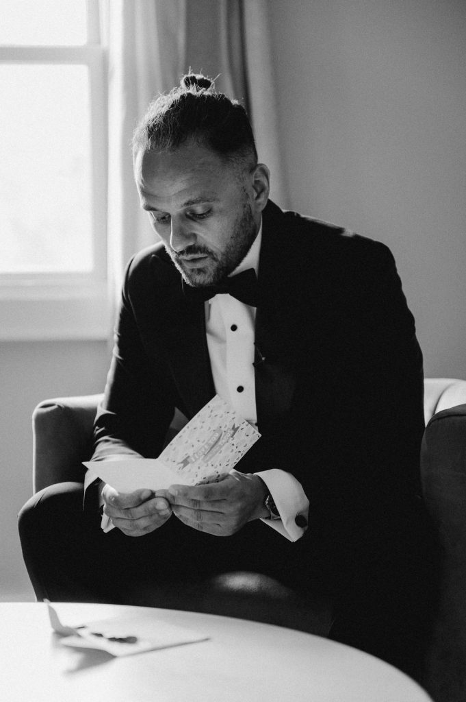 Savannah Groom reading wedding card