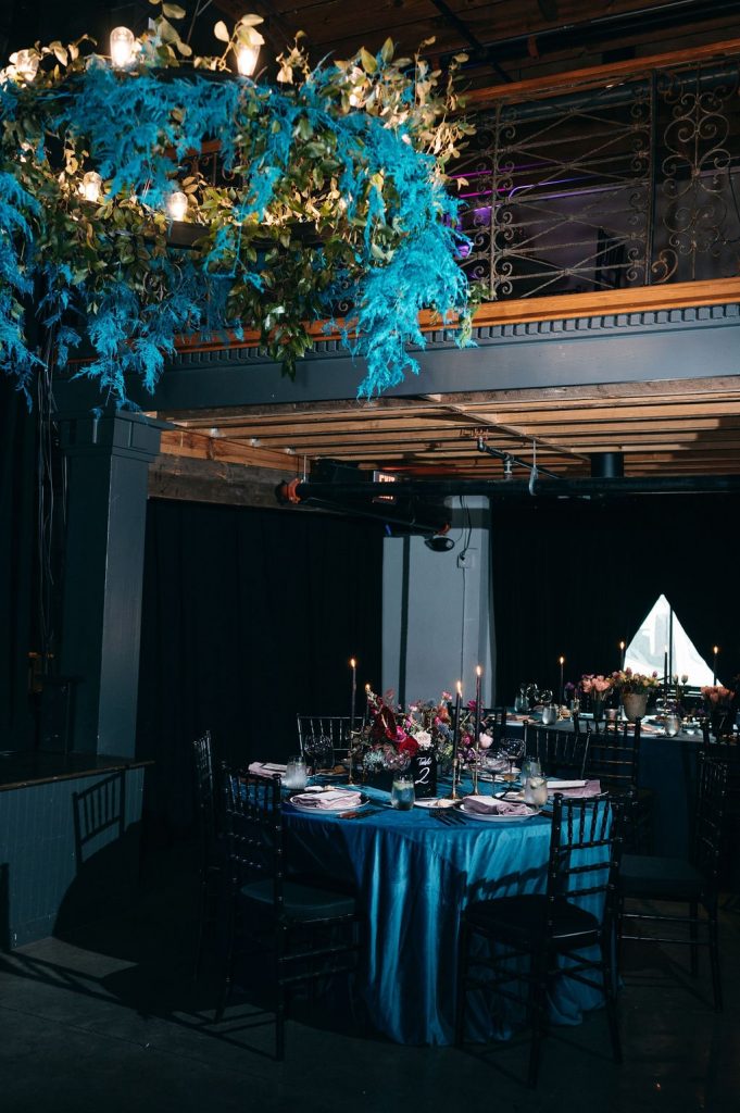 Dark and moody wedding reception decor