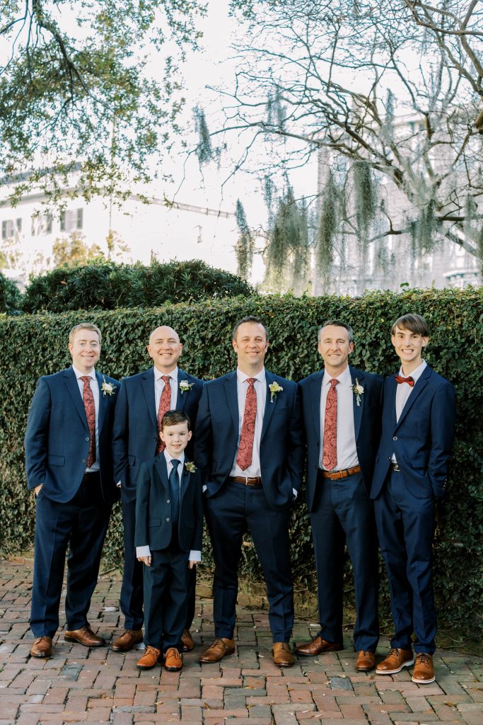 Navy and burgundy grooms suits