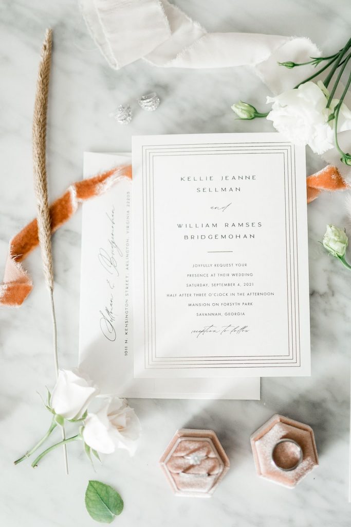 White wedding invitation flatlay