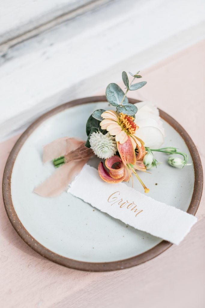 Grooms boutonnière with peach florals