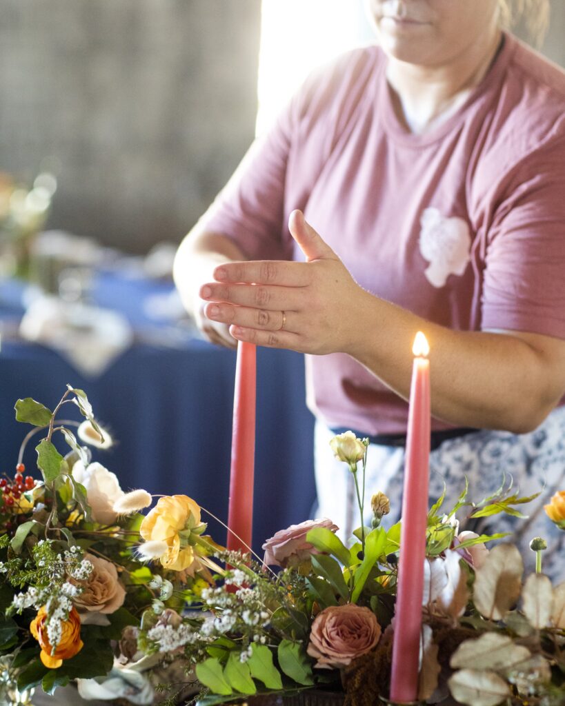 wedding florist lighting candles