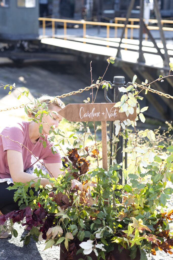 Wedding florist setting up flowers