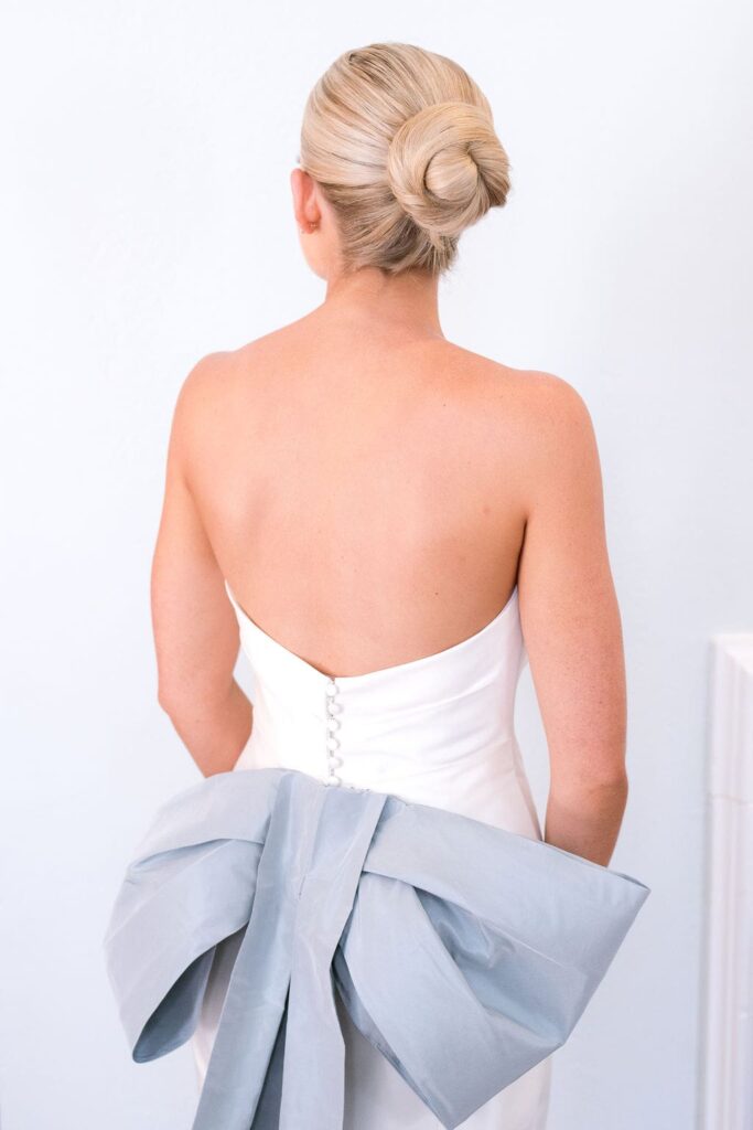 Birde with blue bow on dress