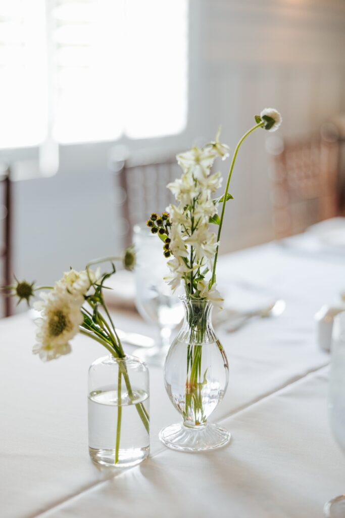 White flowers in bud vases