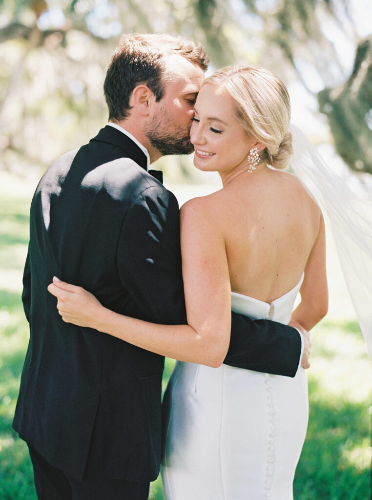 Bride and groom portrait under Spanish moss tree