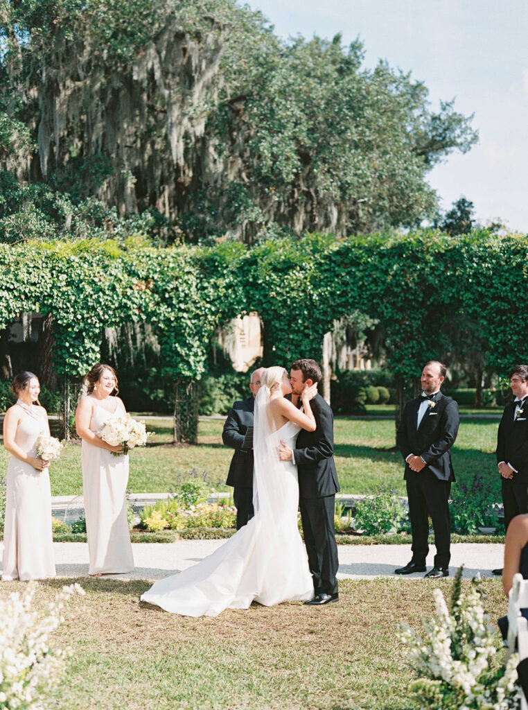 Bride and groom kissing at Crane Cottage wedding ceremony