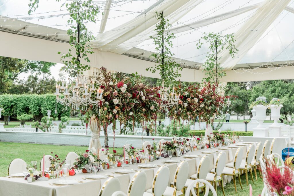 Hanging floral installation with chandeliers