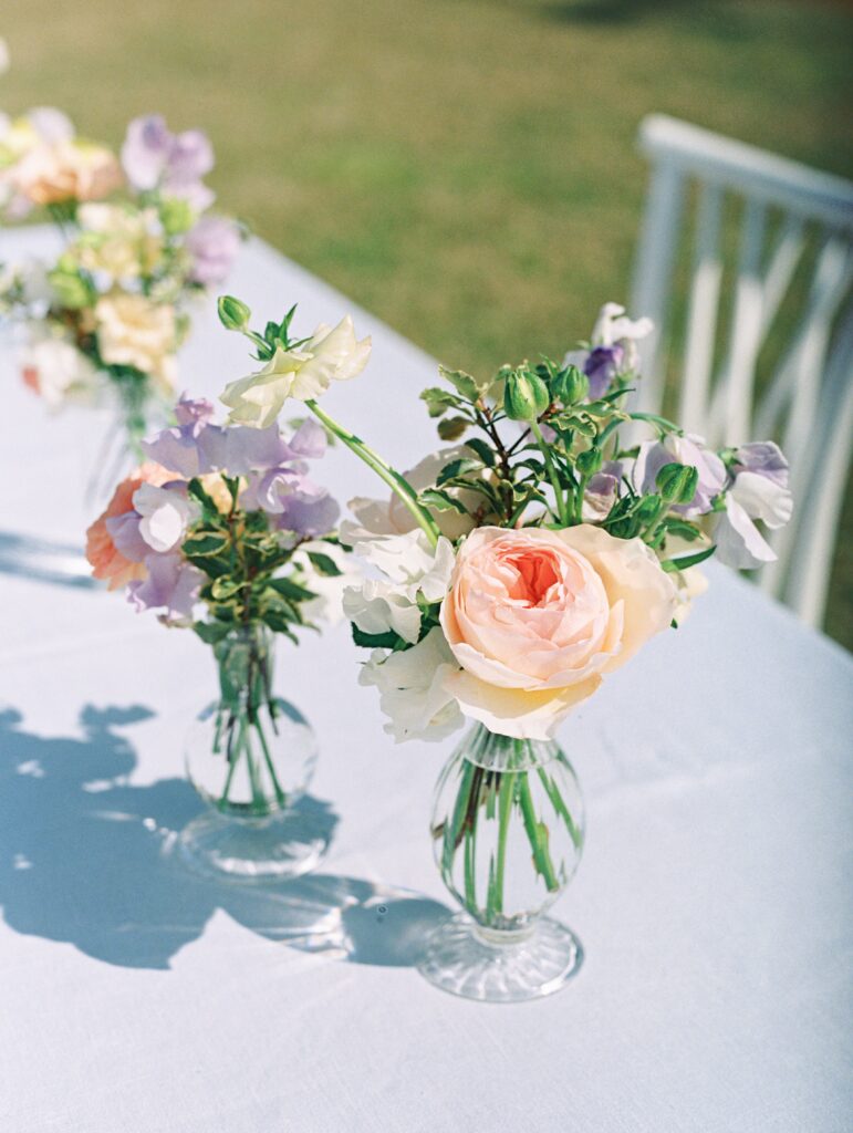 Blush pink and purple bud vase floral arrnagements