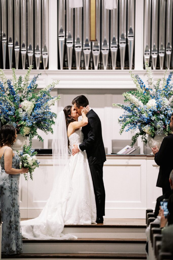 Bride and groom kissing at St. Simons Church ceremony