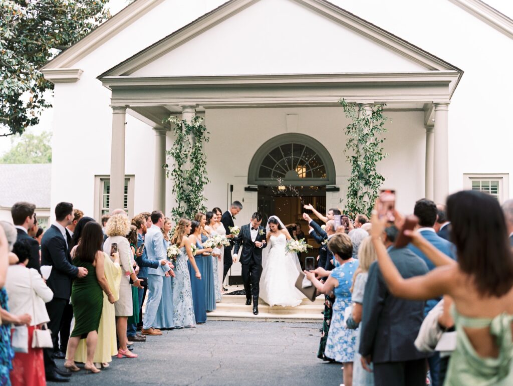 Bride and groom exiting St. Simons Church ceremony